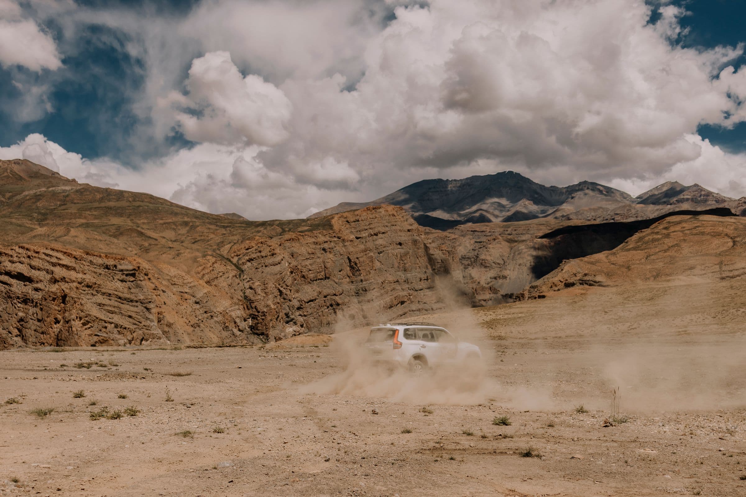 The highway cutting through the bare rock walls of the Spiti valley